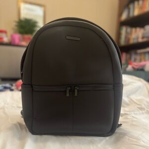 My tag alongs Hunter green backpack